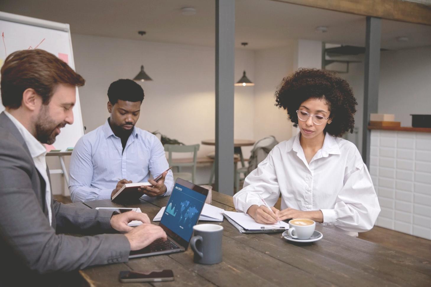 Professional reviewing financial data on computer screen